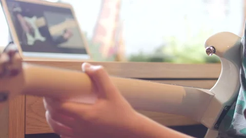  Boy learning to play electric guitar using online lessons. Stock Footage 147936549
