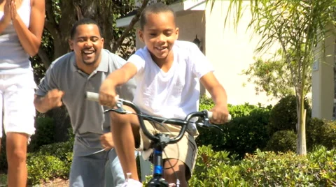 Boy Learning to Ride a Bicycle Stock Footage 3678610