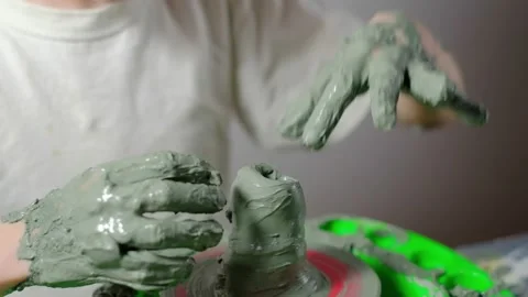 Boy learning to stick on a potter's wheel close-up Stock Footage 151642806