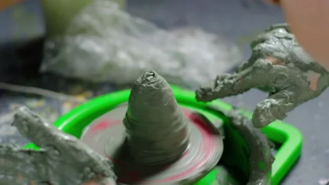 Boy learning to stick on a potter's wheel close-up Video stock 151643552