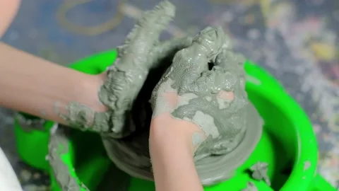 Boy learning to stick on a potter's wheel close-up Video stock 151643578