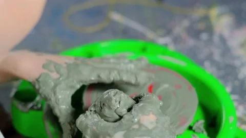 Boy learning to stick on a potter's wheel close-up Video stock 151643602