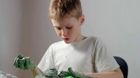 Boy learning to stick on a potter's wheel close-up Video stock 151643637