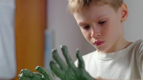 Boy learning to stick on a potter's wheel close-up Video stock 151643858