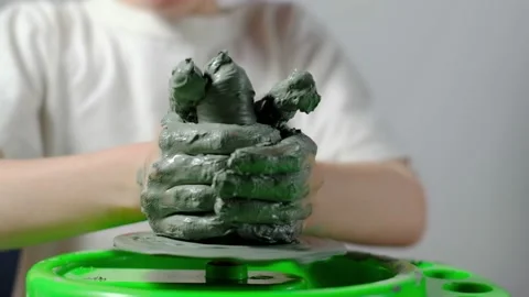Boy learning to stick on a potter's wheel close-up Video stock 151643909