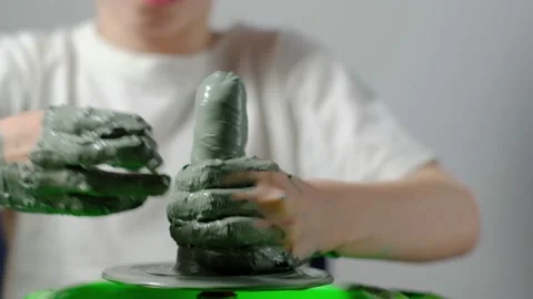 Boy learning to stick on a potter's wheel close-up Video stock 151643938