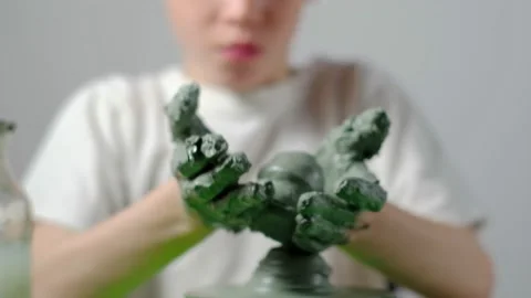 Boy learning to stick on a potter's wheel close-up Video stock 151643955