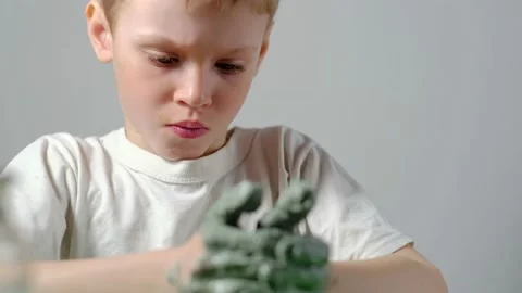 Boy learning to stick on a potter's wheel close-up Video stock 151643970