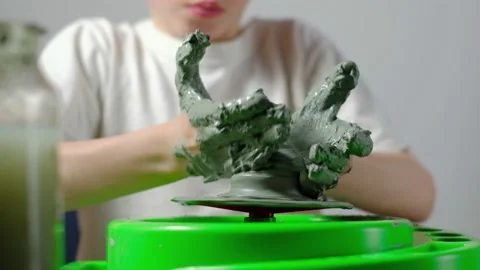 Boy learning to stick on a potter's wheel close-up Video stock 151643994