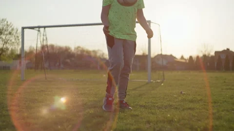 The boy learns to control the ball for playing football. Stock Footage 195164068