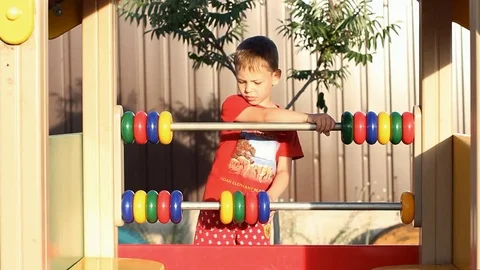 The boy learns to count. Video stock 77951300