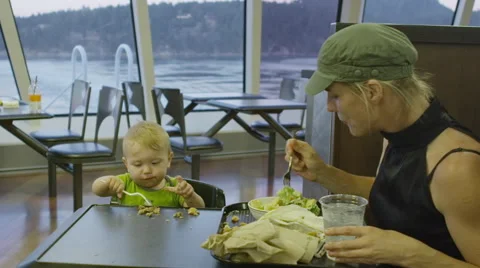 Boy learns to eat with fork Stock Footage 48009163