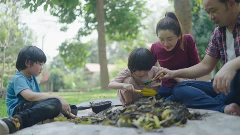 Boy learns how to make natural compost. Stock Footage 179375570