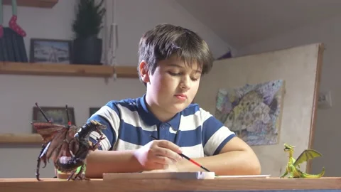 Boy Learns To Paint. Evening Classes in the Nursery on the Background of Toys. Stock Footage 148095704