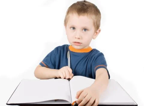 Boy learns to write Stock Photos