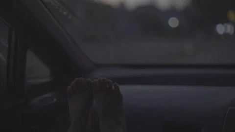 Boy leg put on car enjoy travel in morning sunrise Stock Footage 236737709
