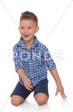The boy lies on the floor Stock Photos