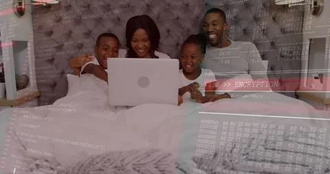 Boy lifting laptop initiating encryption overlay code while family watching via Stock Footage 318544651