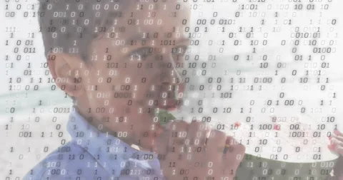 Boy lifting watermelon slice and biting as drifting binary code overlay shows Stock Footage 318758629