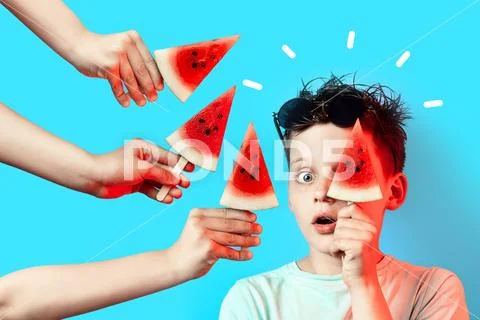 Boy in light t-shirt watermelon on a stick closes one eye on a blue backgroun Stock Photos
