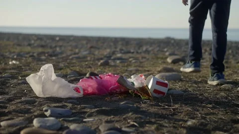 A boy litters environment causing lot of troubles in future Stock Footage 221721789