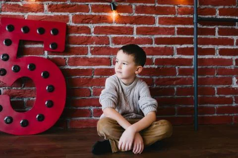 Boy in a loft studio Stock Photos
