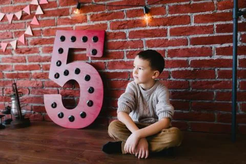 Boy in a loft studio Stock Photos