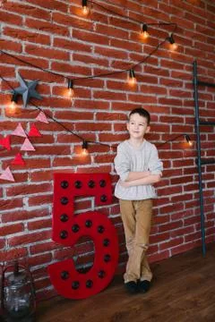 Boy in a loft studio Stock Photos