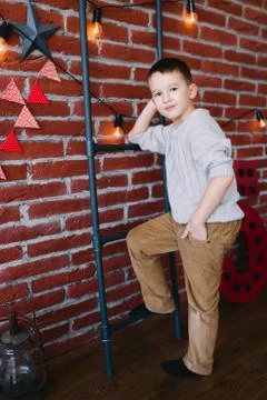 Boy in a loft studio Stock Photos