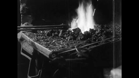 Boy look the worker prepare horseshoe in workshop - 1953 Stock Footage 95197422