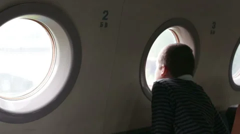Boy looking at an airplane window Stock Footage 65050492