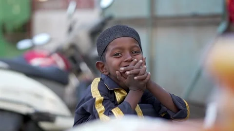 Boy is looking at the camera and giving a smiling Stock Footage 268946126