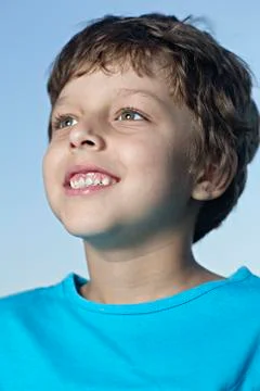 A boy looking off camera with excitement Stock Photos
