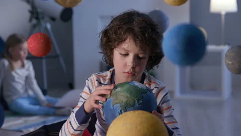 Boy Looking at Camera at Interstellar Modern Playground Close-up. Playful Spacem Stock Footage 199478033