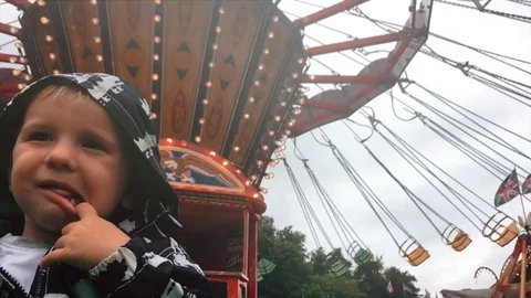 Boy looking at the carousel. Stock Footage 71353451