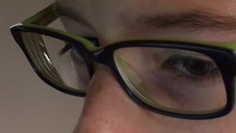 Boy Looking at Computer Close Up Video stock 79112969