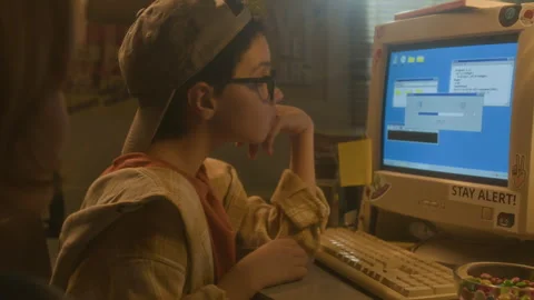 Boy Looking at Computer Screen in 90s Stock Footage 304863288
