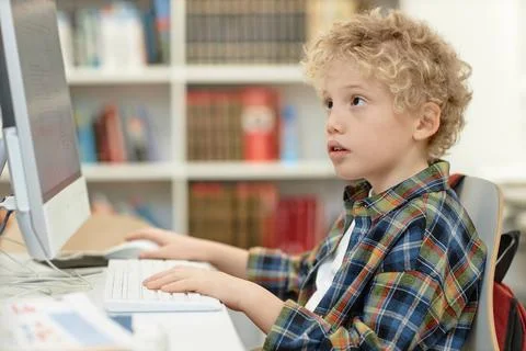 Boy Looking at Computer Screen in Programming Class Stock Photos