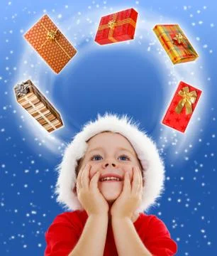 Boy looking to copy space surrounded by gifts Stock Photos
