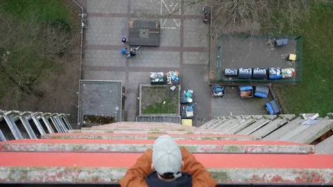 Boy looking down from Skyscraper Video stock 124254613