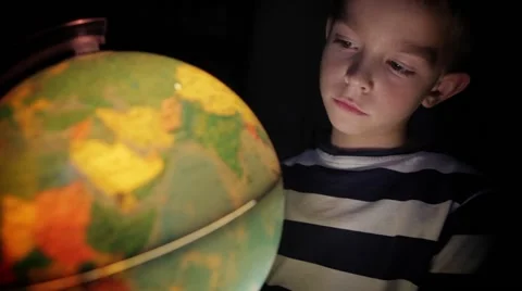 Boy looking at globe Stock Footage 41607385