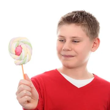 Boy looking at lollipop Stock Photos