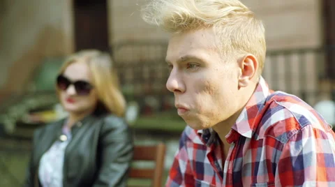 Boy looking morose and talking with his girlfriend 스톡 동영상 56246802