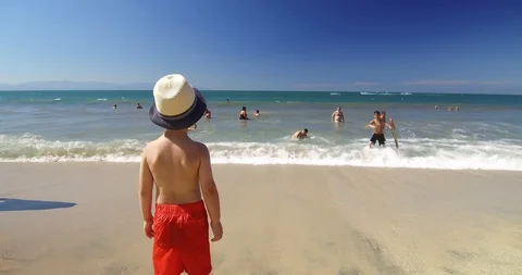 Boy looking on the ocean waves.  Stock Footage 102690168