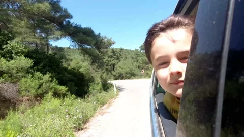 Boy Looking Out The Car Window Video stock 132060158