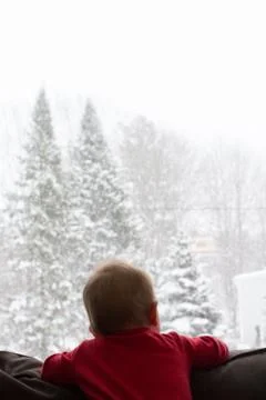 Boy Looking Out Window Stock Photos