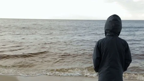 Boy looking at the sea, rear view 스톡 동영상 76940671