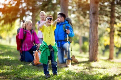 Boy looking through binoculars. Stock Photos