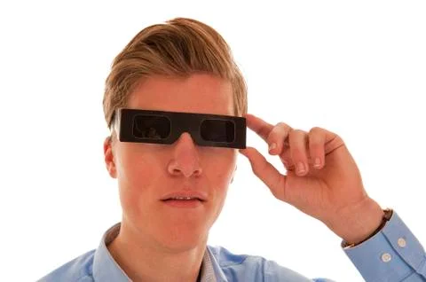 Boy looking through eclipse glasses Stock Photos
