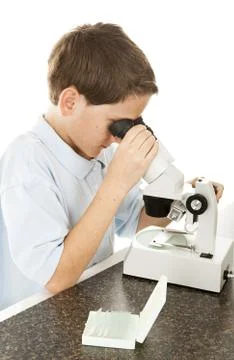 Boy Looking Through Microscope Stock Photos